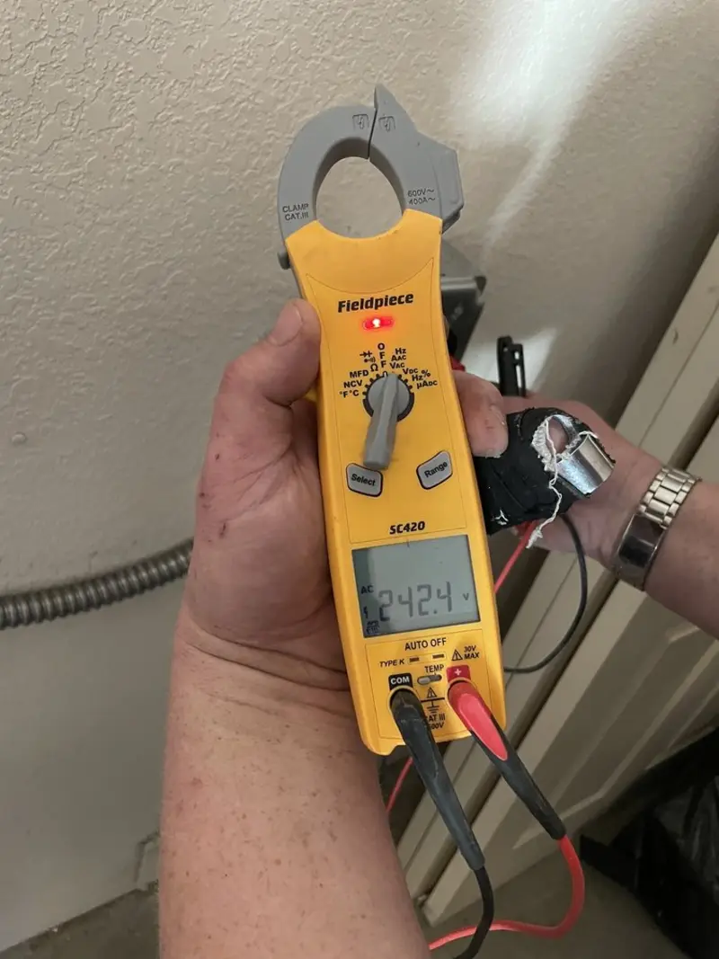 Voltage testing with clamp meter during Aluminum Wiring Replacement in Tanque Verde